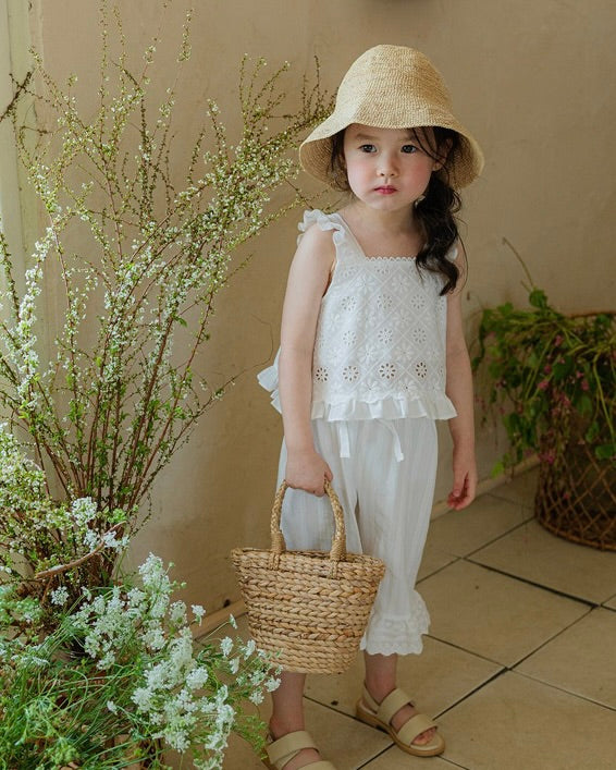 The adorable lace camisole features a charming pattern in soft cotton, with cute chest lace and frill hem details. Paired perfectly with Flo Laurent pants - soft cotton with lace hem and ribbon waist accents. A sweet matching set for everyday or special occasions.