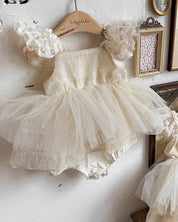 Delicate gold-embroidered floral pattern and dreamy cream color Shiny Baby Suit. Ideal for birthday parties.